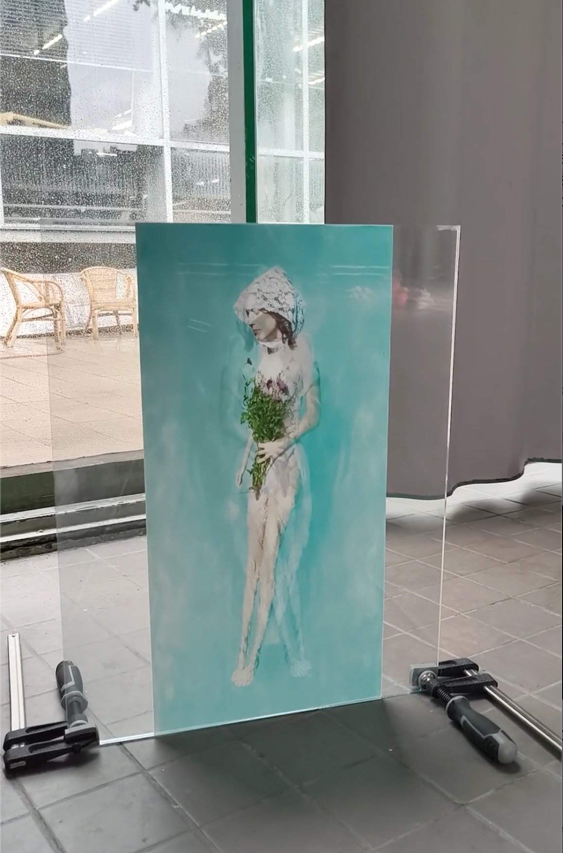Becoming — image between glass